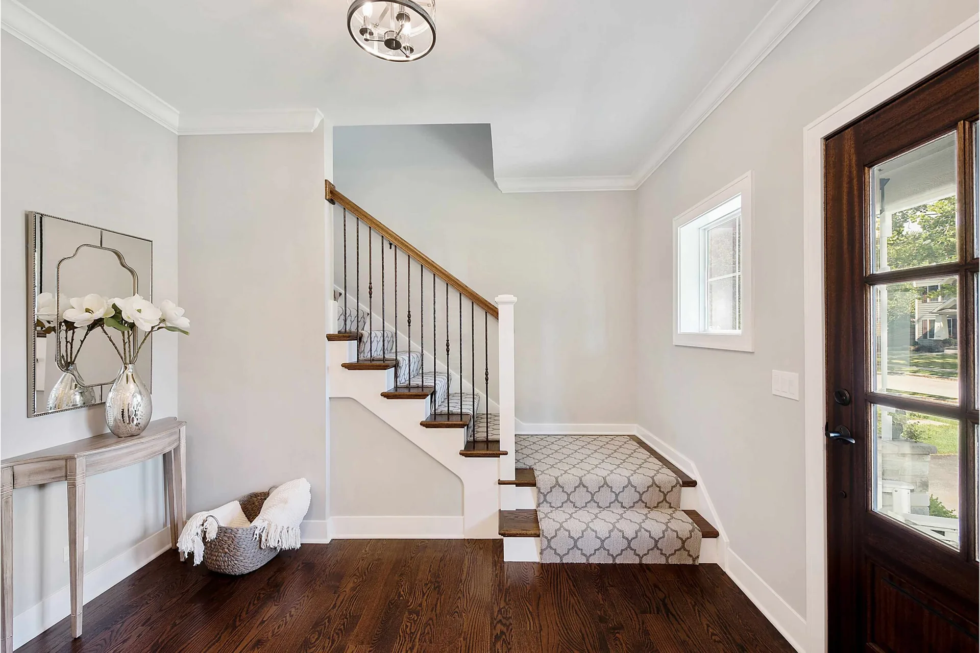 Open concept home foyer and living room with cohesive colour palette — interior painting West Vancouver BC by Colour Craft Painting