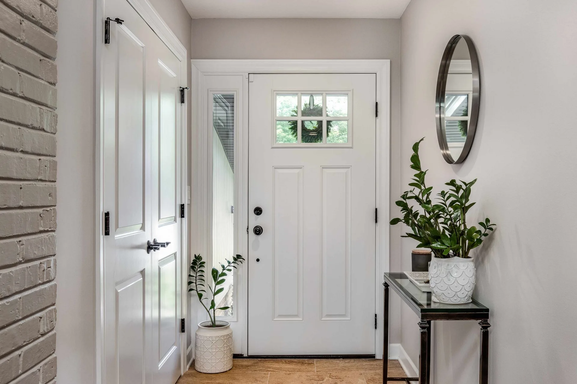 Modern foyer with bold accent wall and cohesive colour scheme — interior house painting West Vancouver BC by Colour Craft Painting