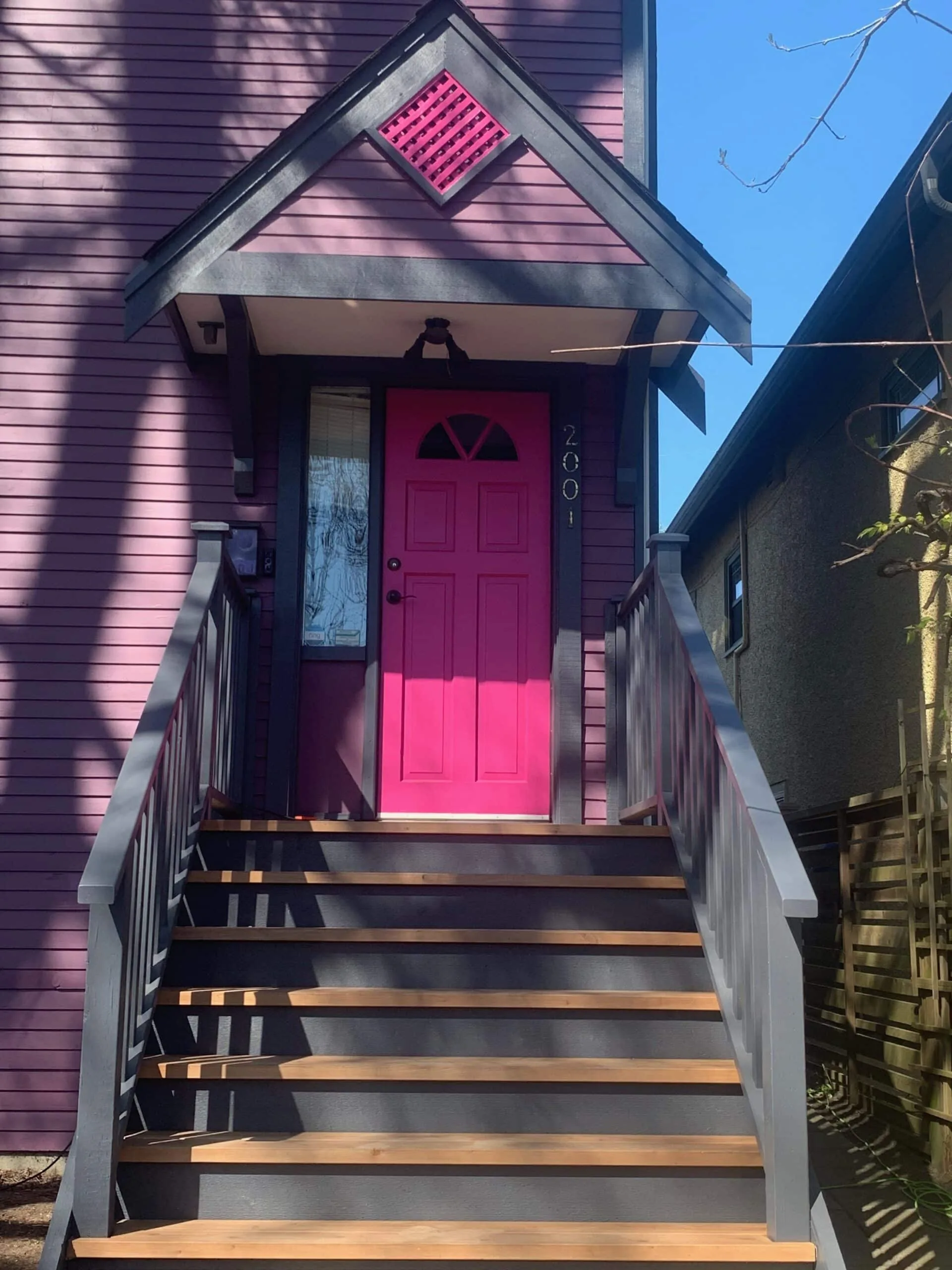 Painter working on cedar wood siding in Squamish BC — Colour Craft Painting
