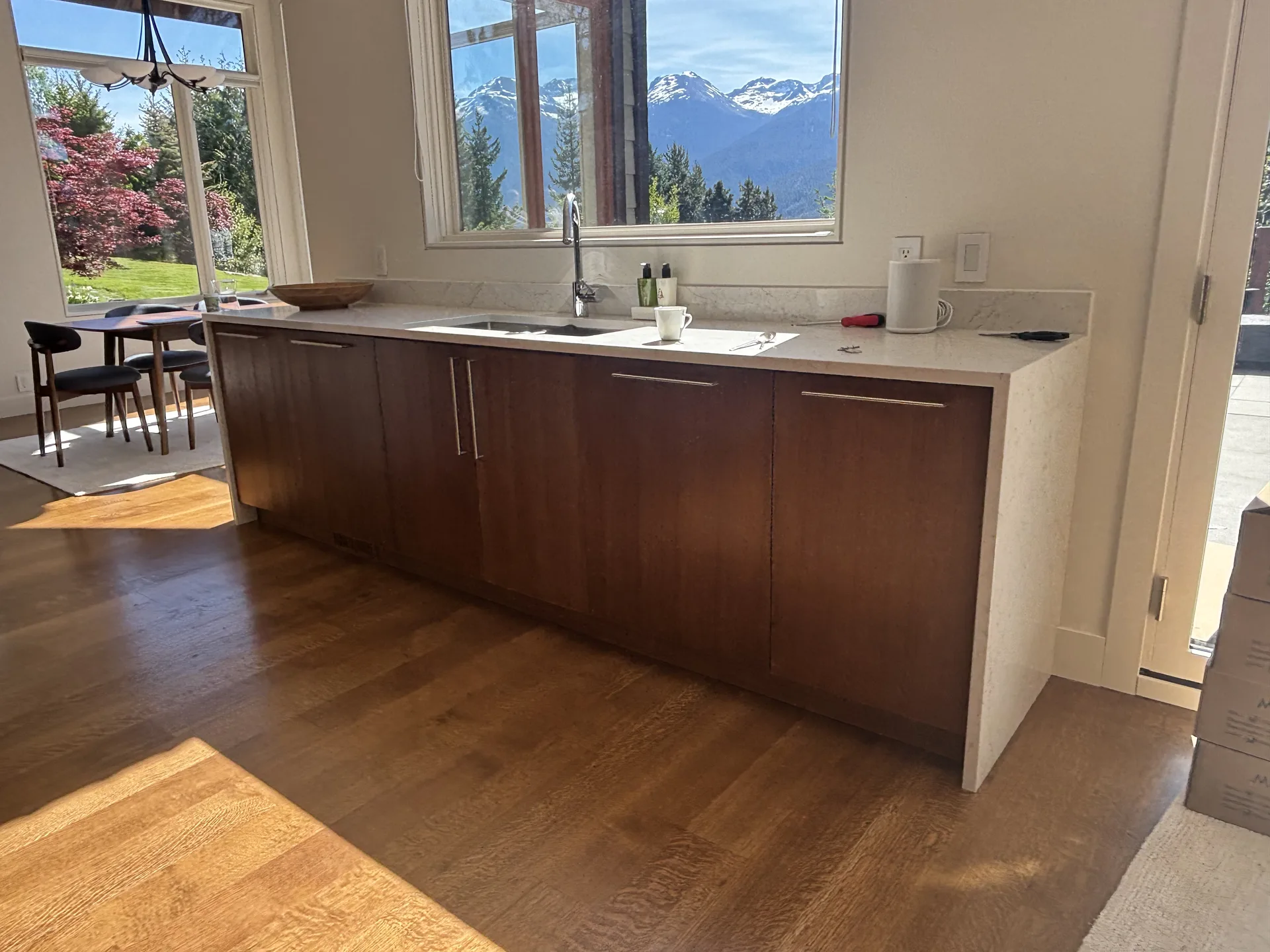 Full kitchen cabinet painting transformation — dark charcoal finish by Colour Craft Painting