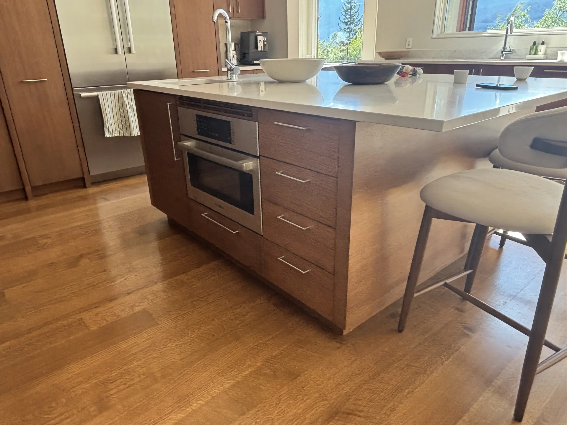 Cabinet painting near sink area — dark kitchen transformation by Colour Craft Painting