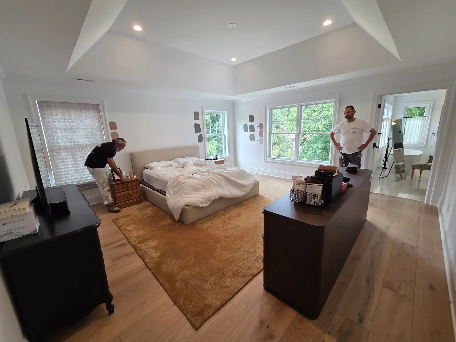 Before main bedroom with contractor-white walls at Carly’s Bala Cynwyd home
