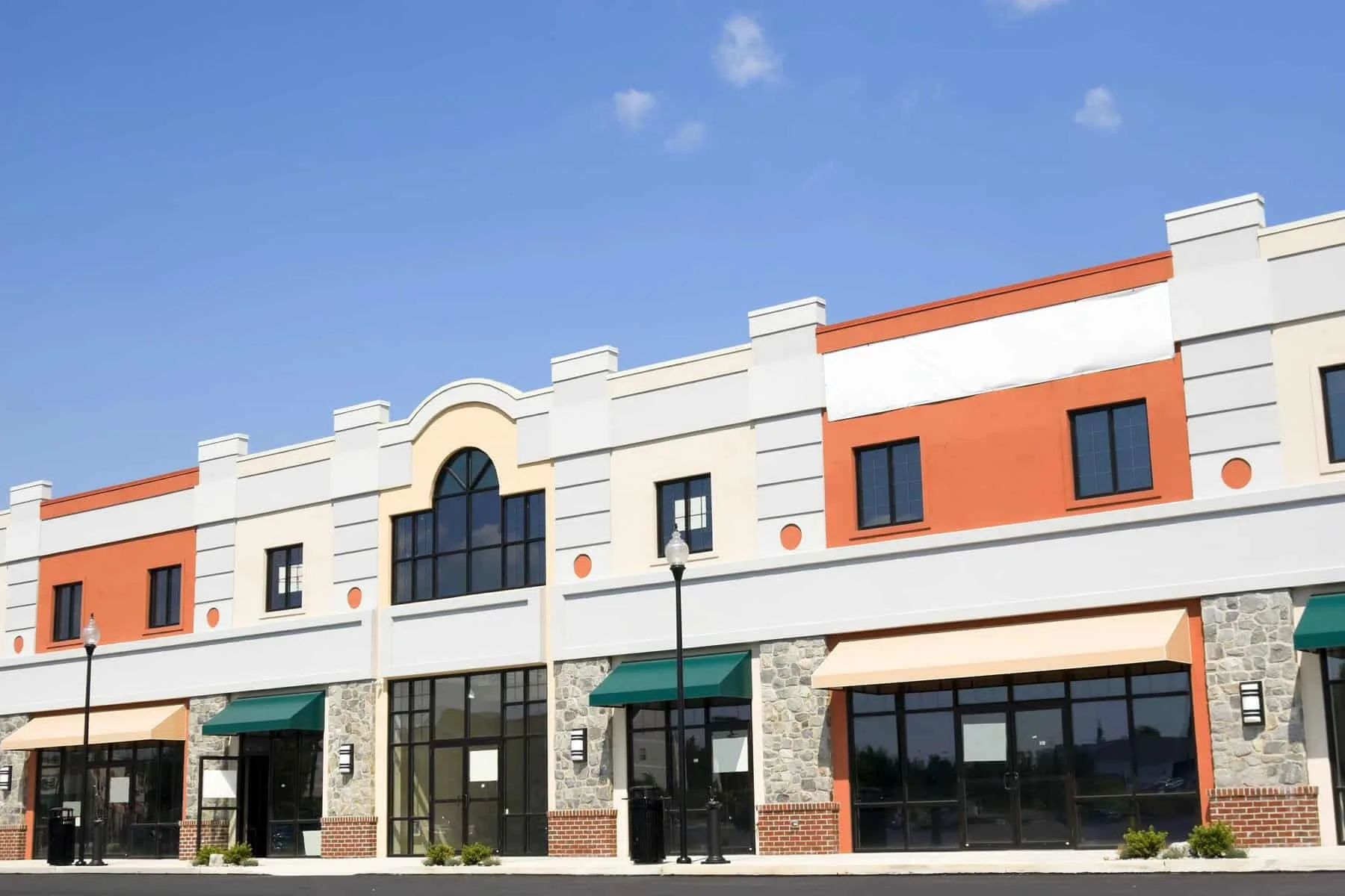 Commercial plaza storefront exterior painting — Colour Craft Painting