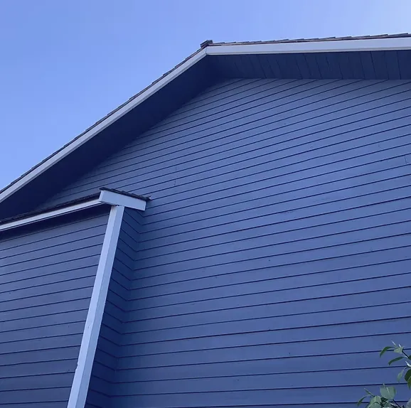 After — Navy blue siding and white trim on gable, Brackendale Squamish BC