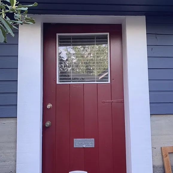After — Burgundy front door on navy blue siding, Brackendale Squamish BC