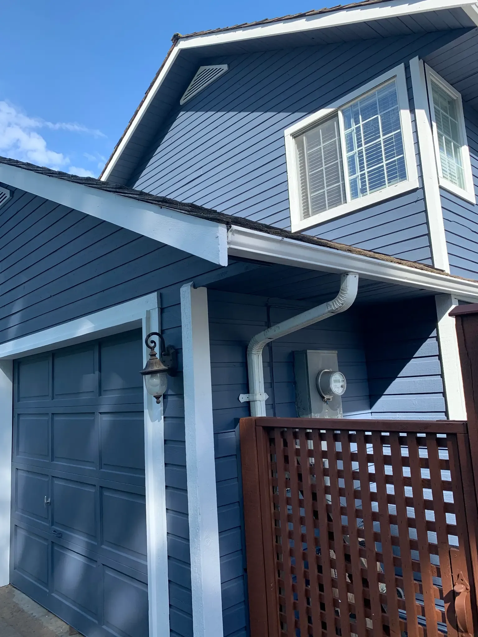 After — Navy blue siding with red door and white trim, Brackendale Squamish BC
