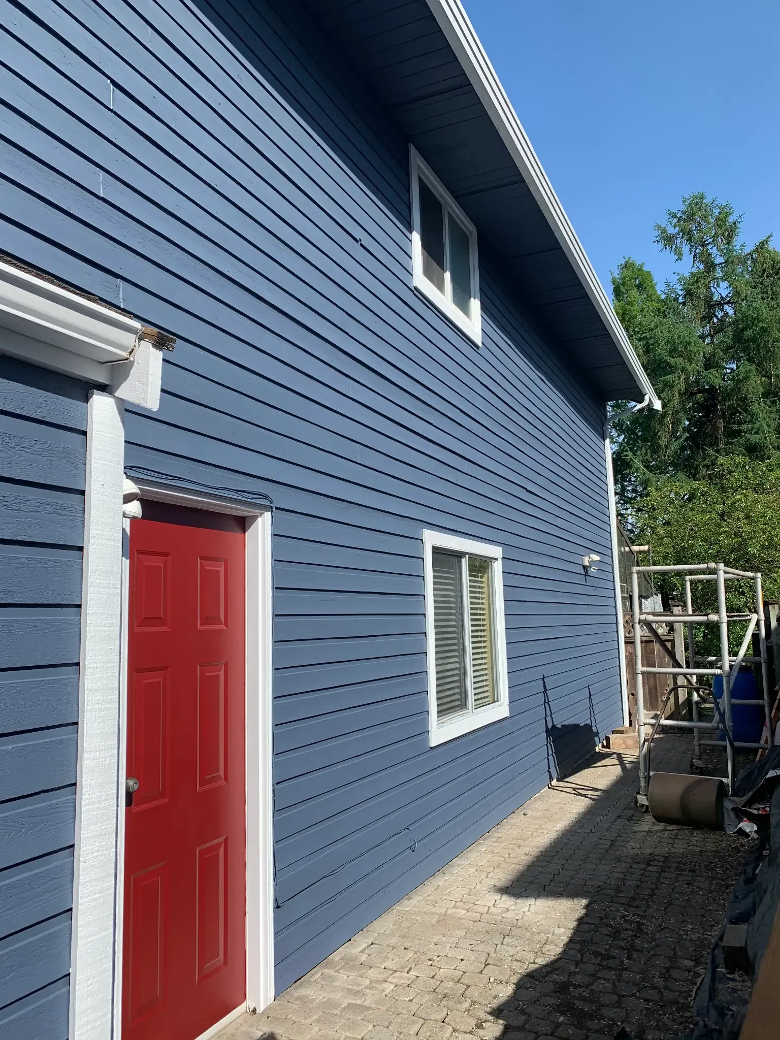 After — Red double front doors with navy siding, Brackendale Squamish BC