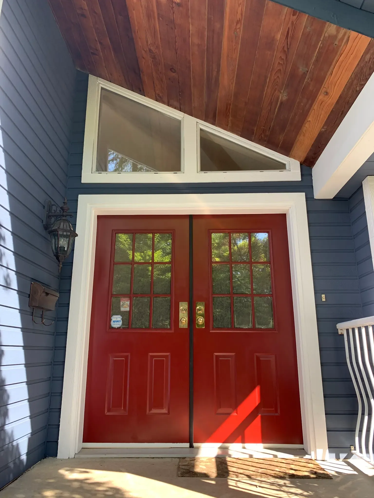 After — Crew member finishing door detail, Brackendale Squamish BC