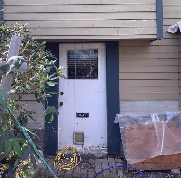 Before — White front door on beige siding, Brackendale Squamish BC