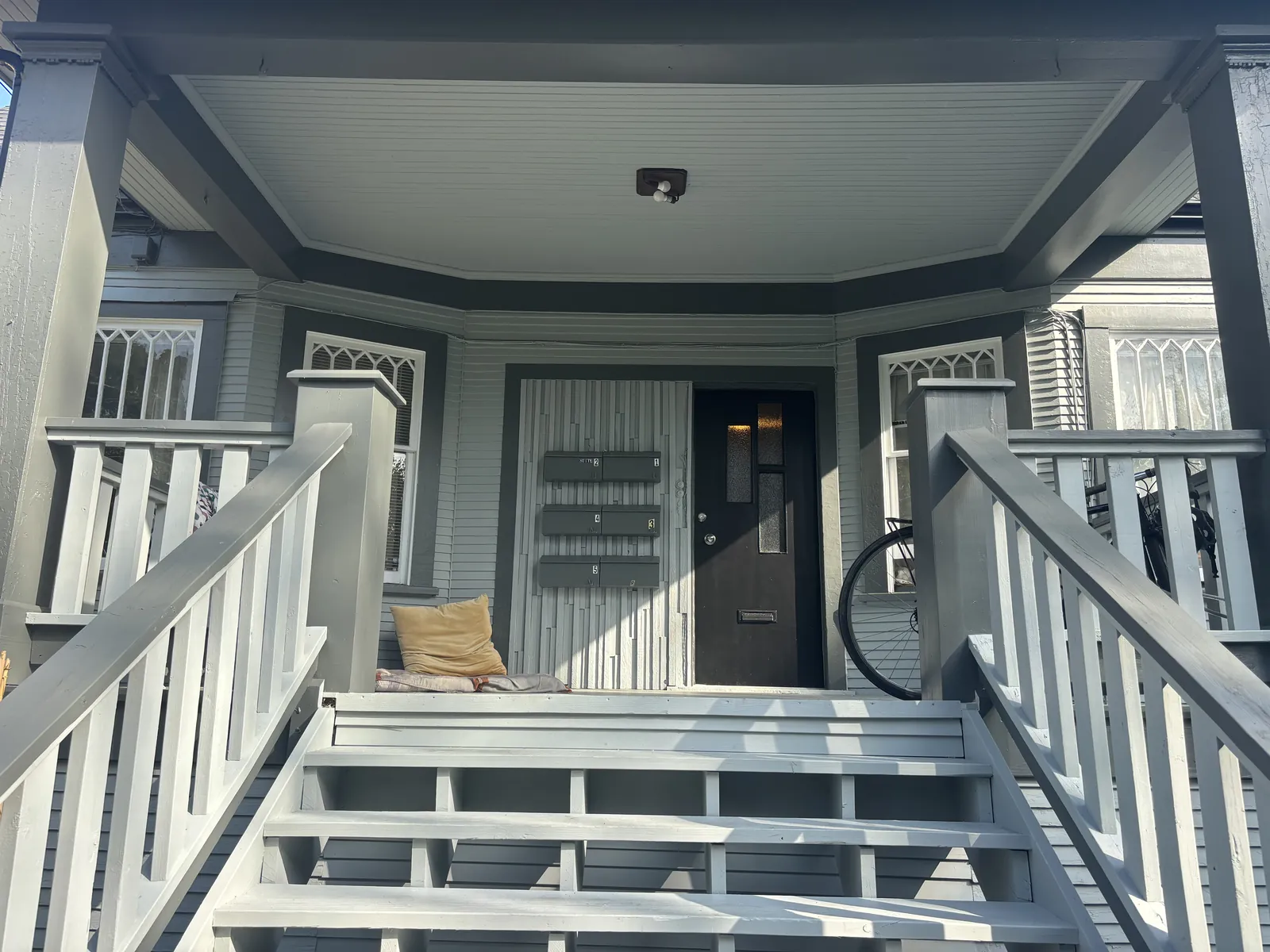 After — East Vancouver heritage home porch detail, fresh paint