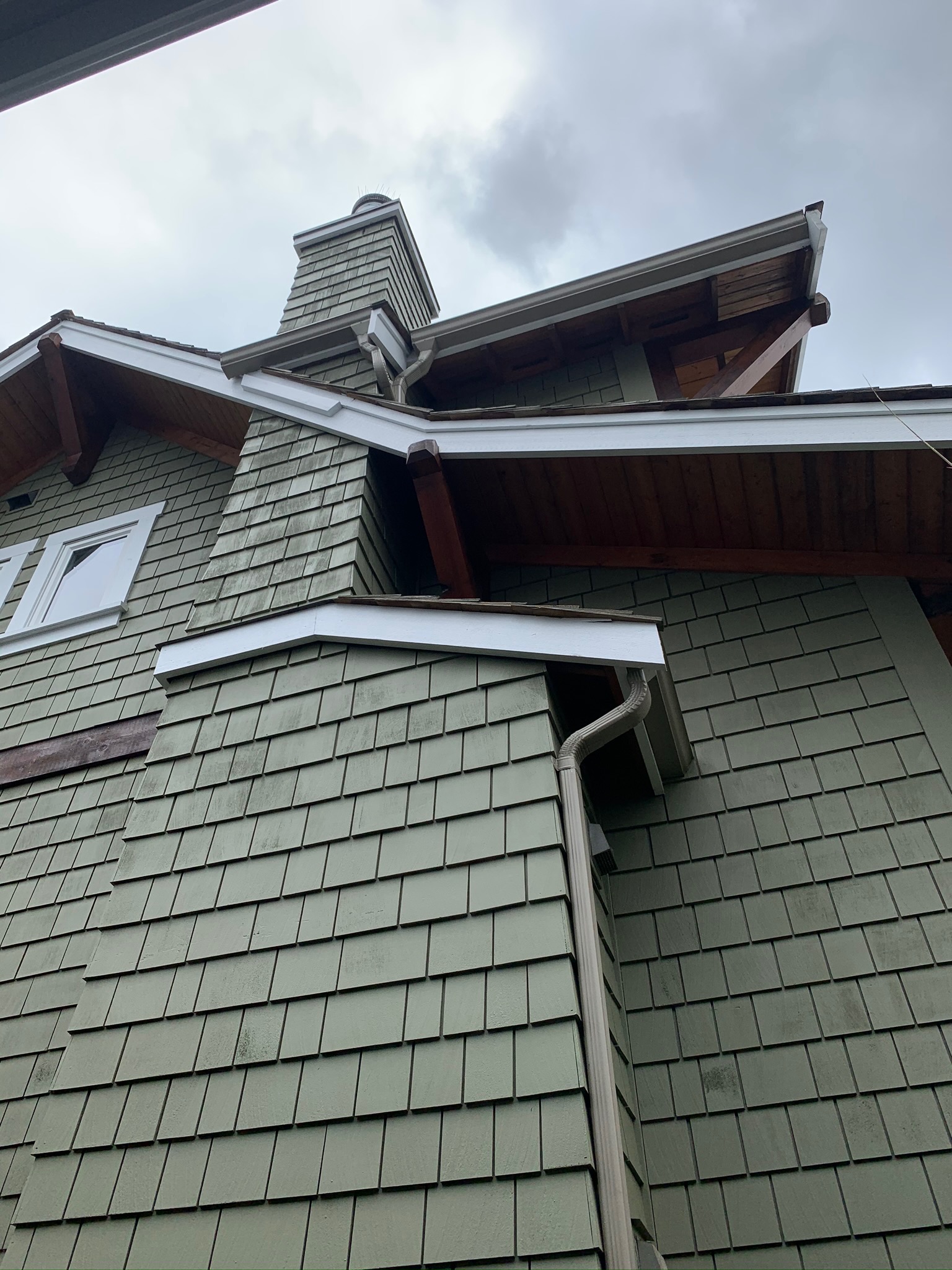 Completed exterior siding, chimney, and trim view at James’s North Vancouver home