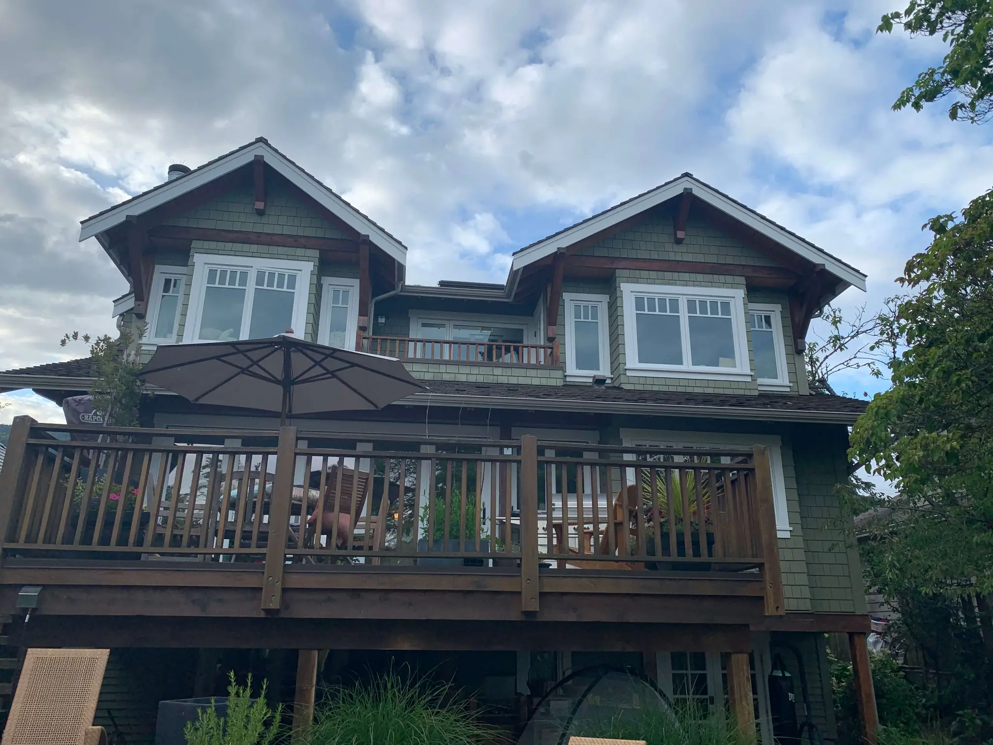 Completed full exterior stain restoration, wide North Vancouver home view