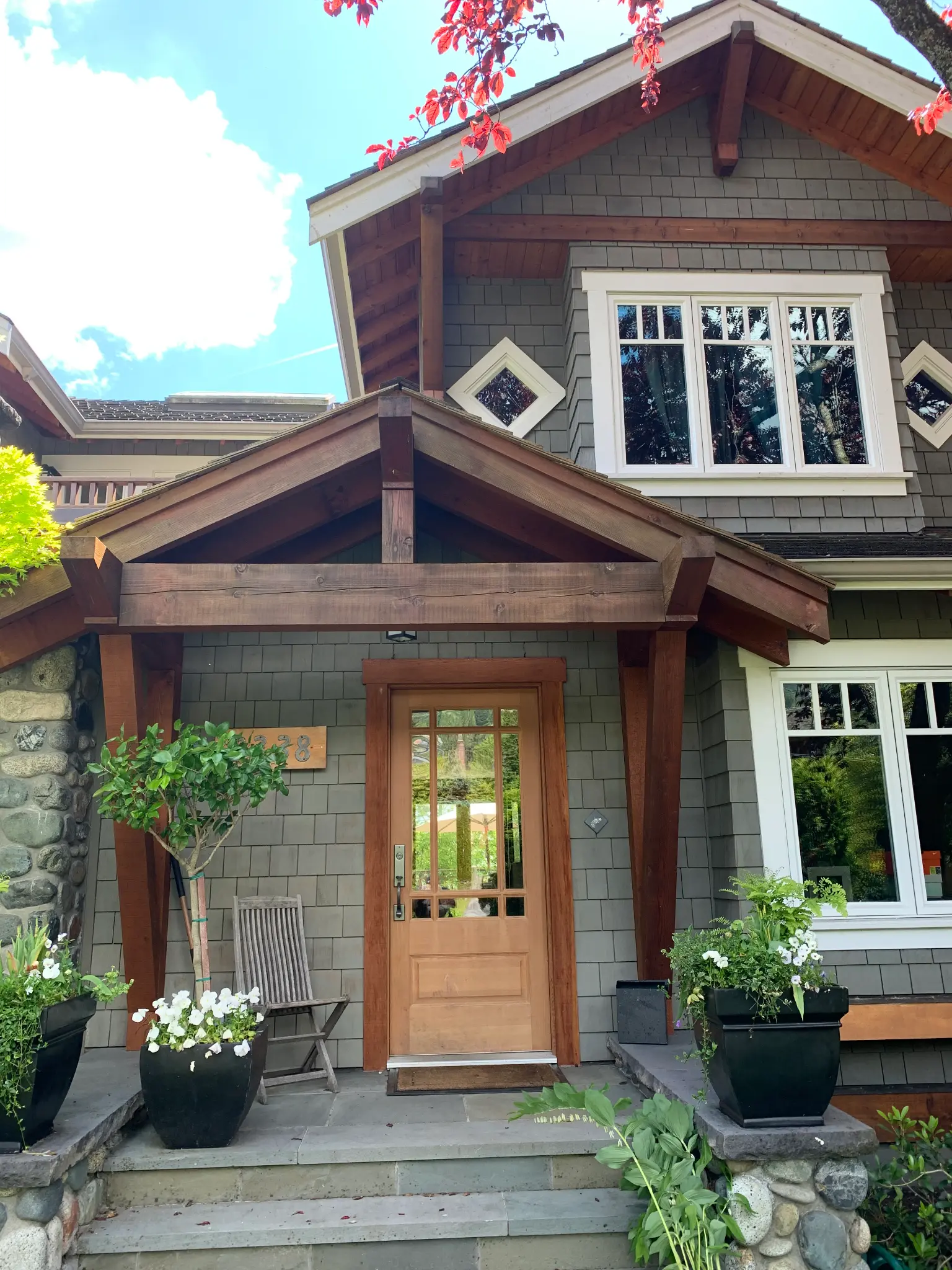Completed front entry and natural wood beam restoration at James’s North Vancouver home