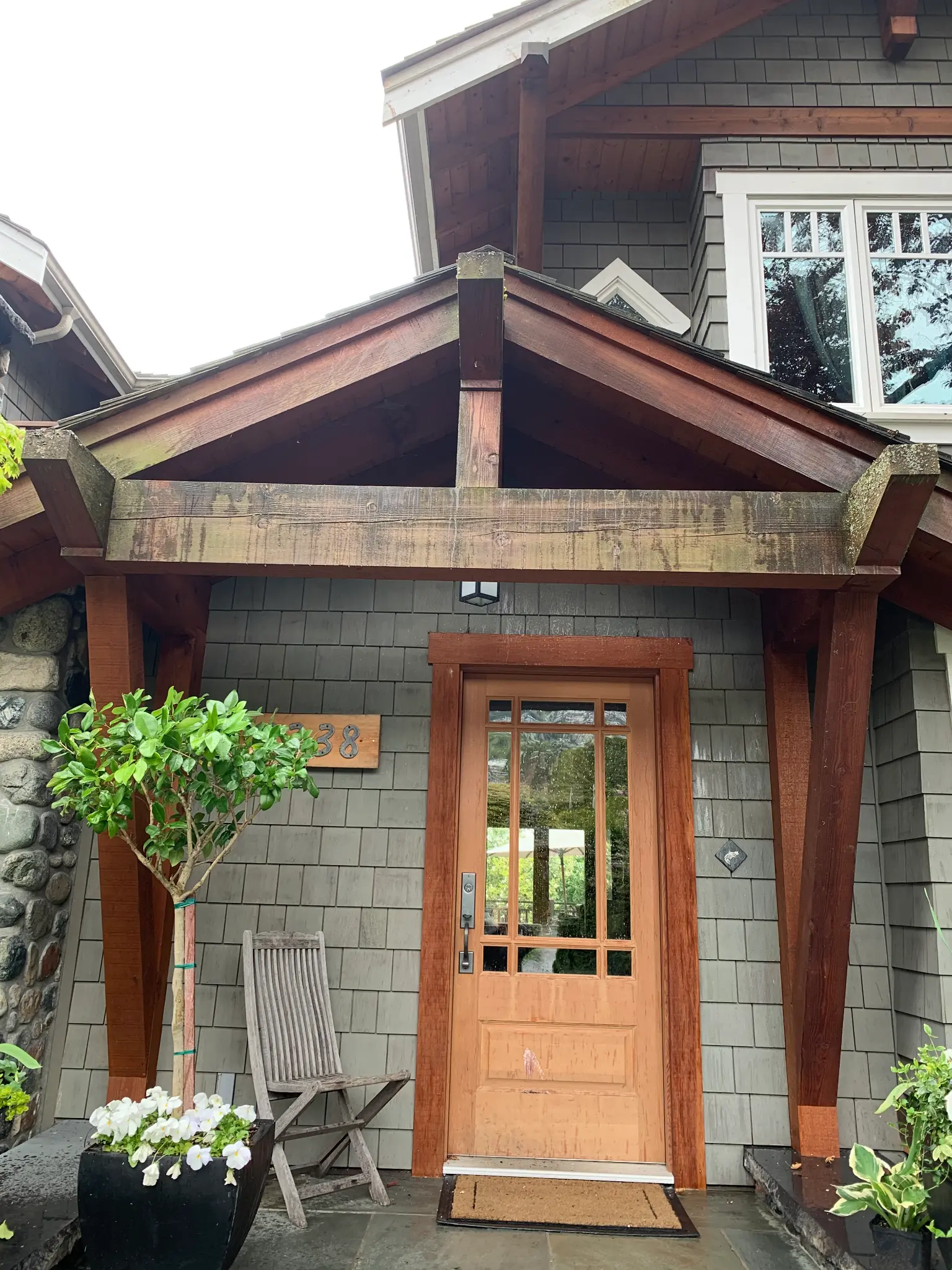 Before exterior stain restoration at James’s North Vancouver home, front entry view