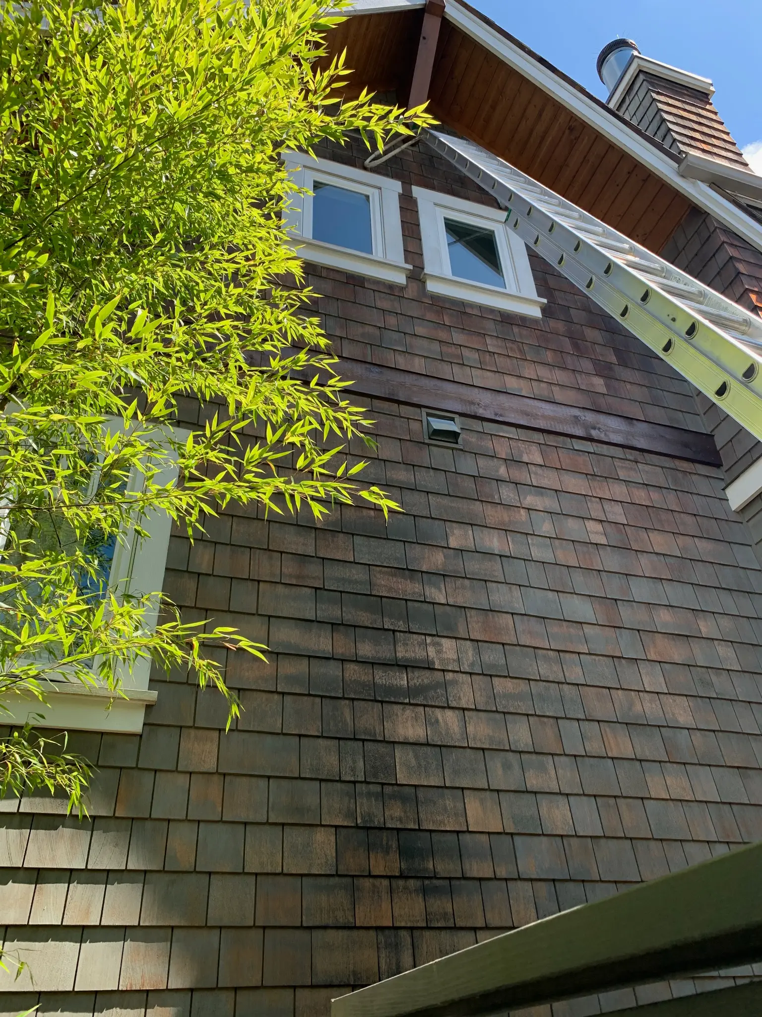 Before siding and trim restoration at James’s North Vancouver home