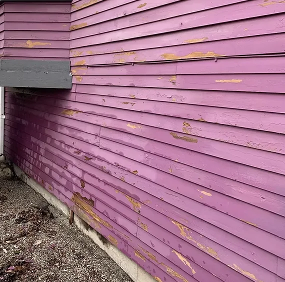 Before — Closeup of peeling and failing pink siding, East Vancouver