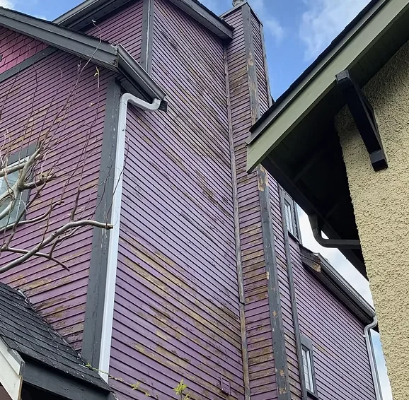 Before — Side wall showing weathered siding condition, East Vancouver