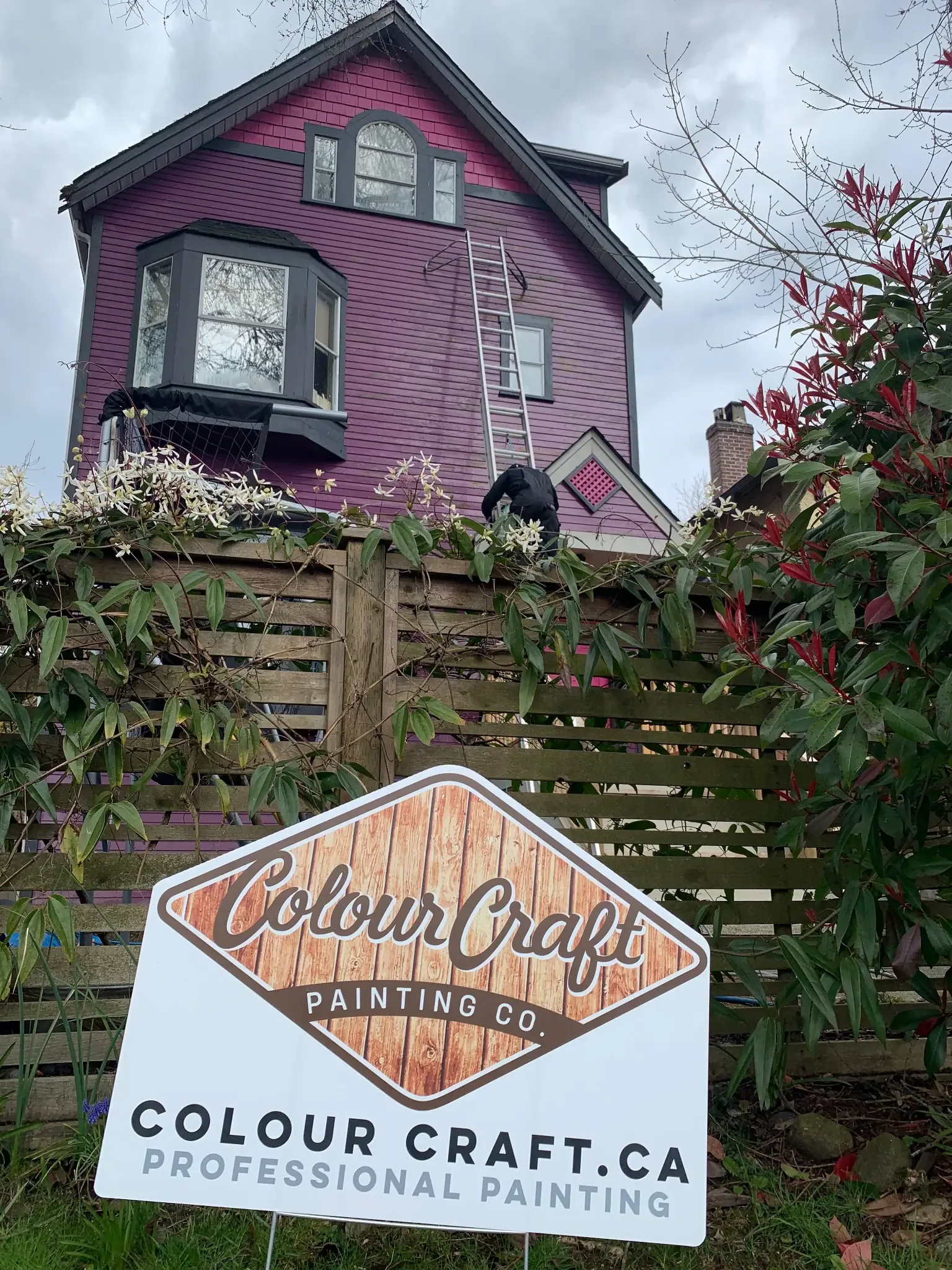 Before — Colour Craft crew on site with sign, East Vancouver