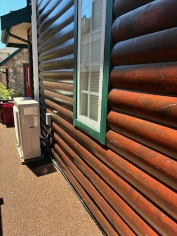 Before close exterior view of weathered log siding in Steveston Richmond BC