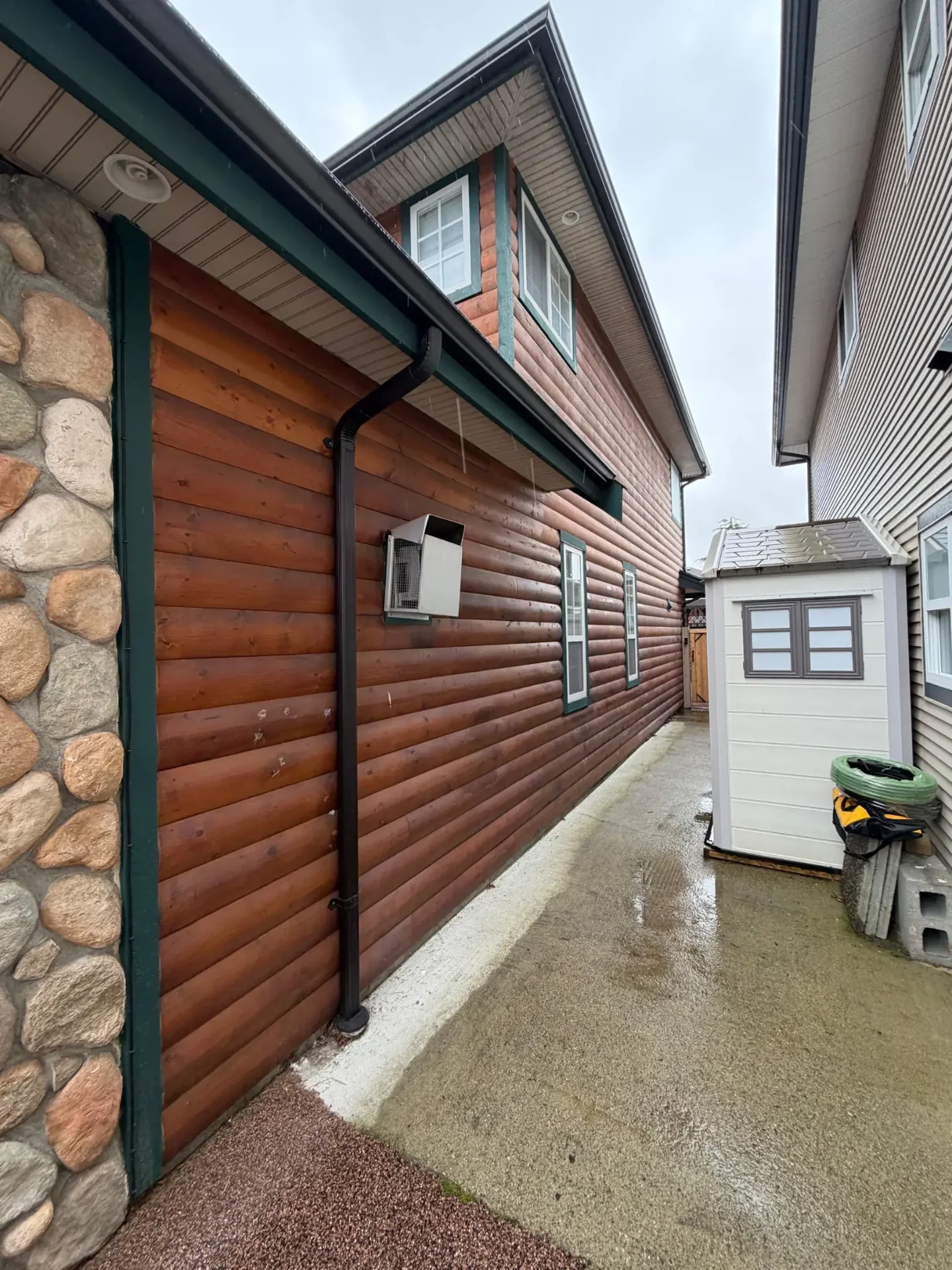 Before side exterior view of log siding in Steveston Richmond BC