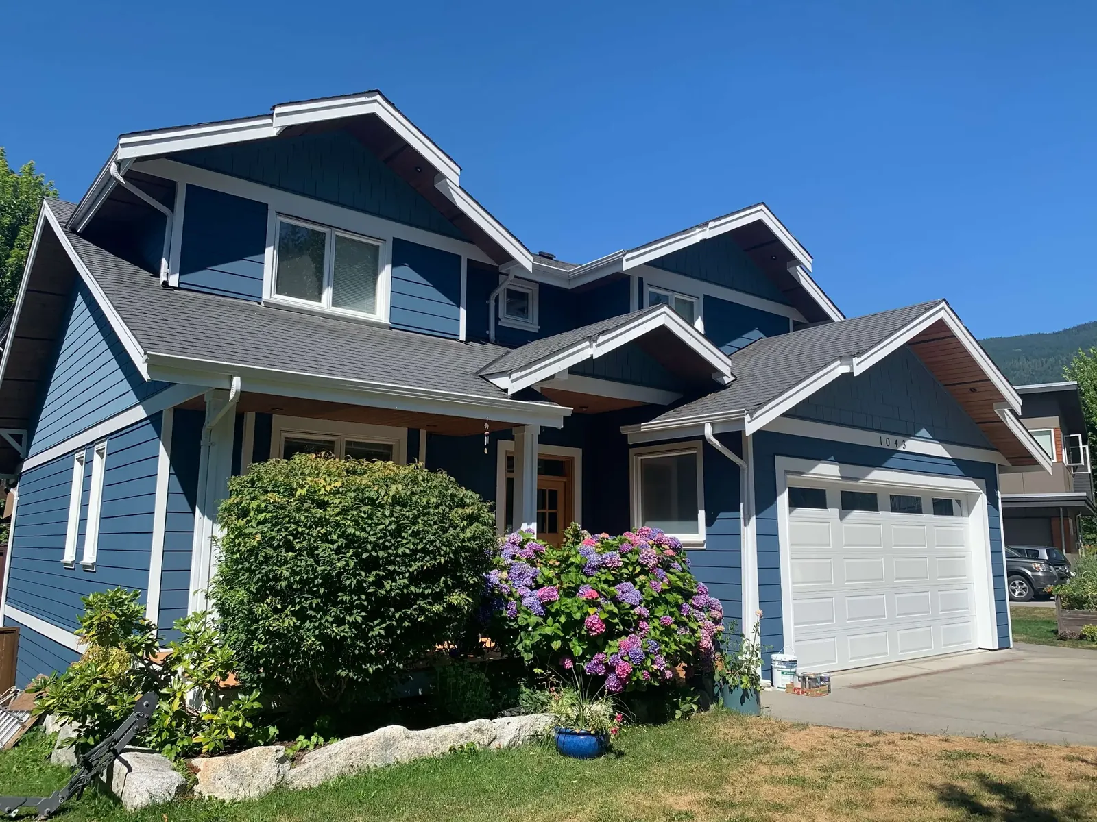 After — Matt residence, Garibaldi Highlands Squamish — completed blue siding transformation