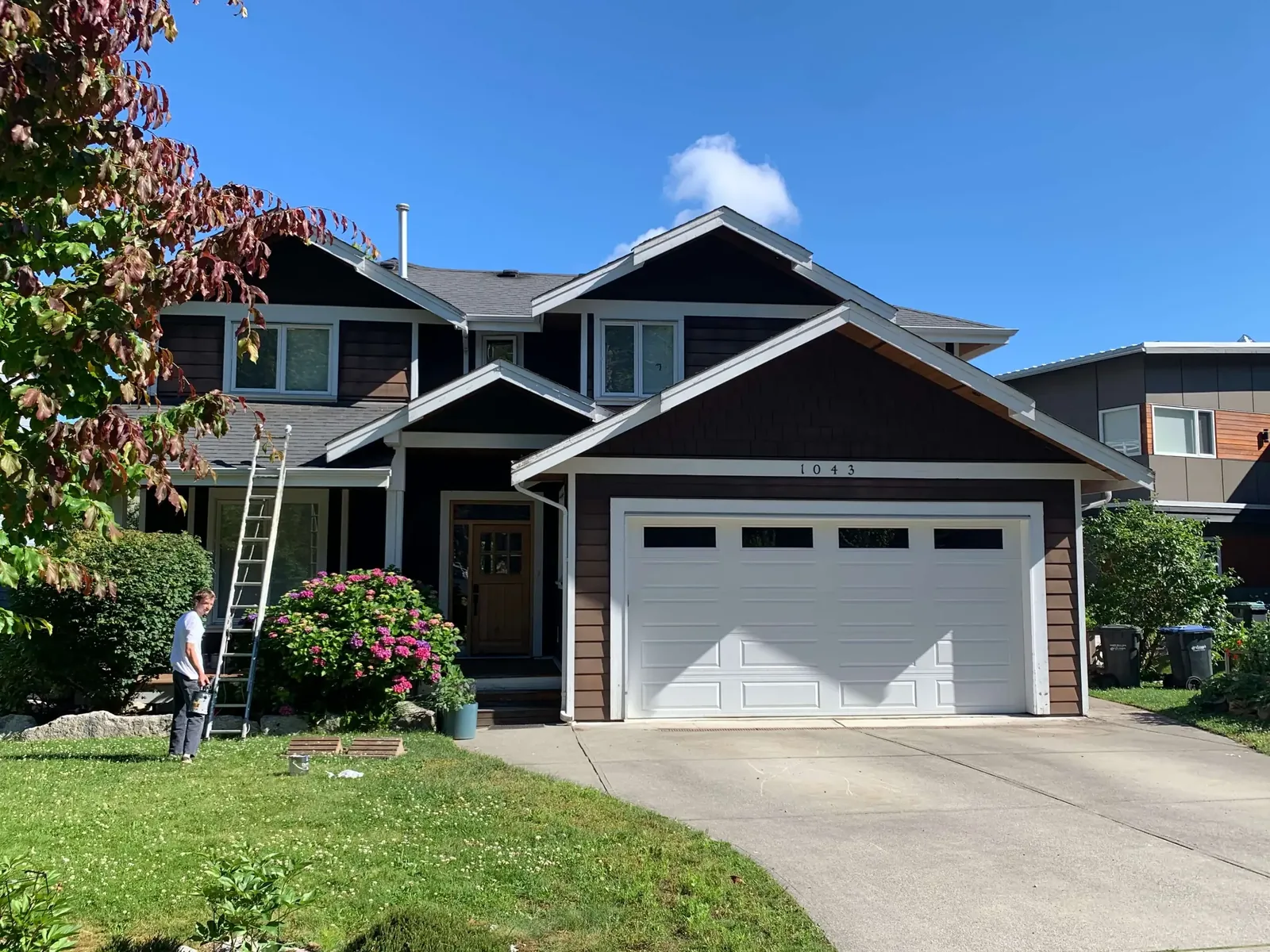 Before — Matt residence, Garibaldi Highlands Squamish — dark brown siding with crew on ladders