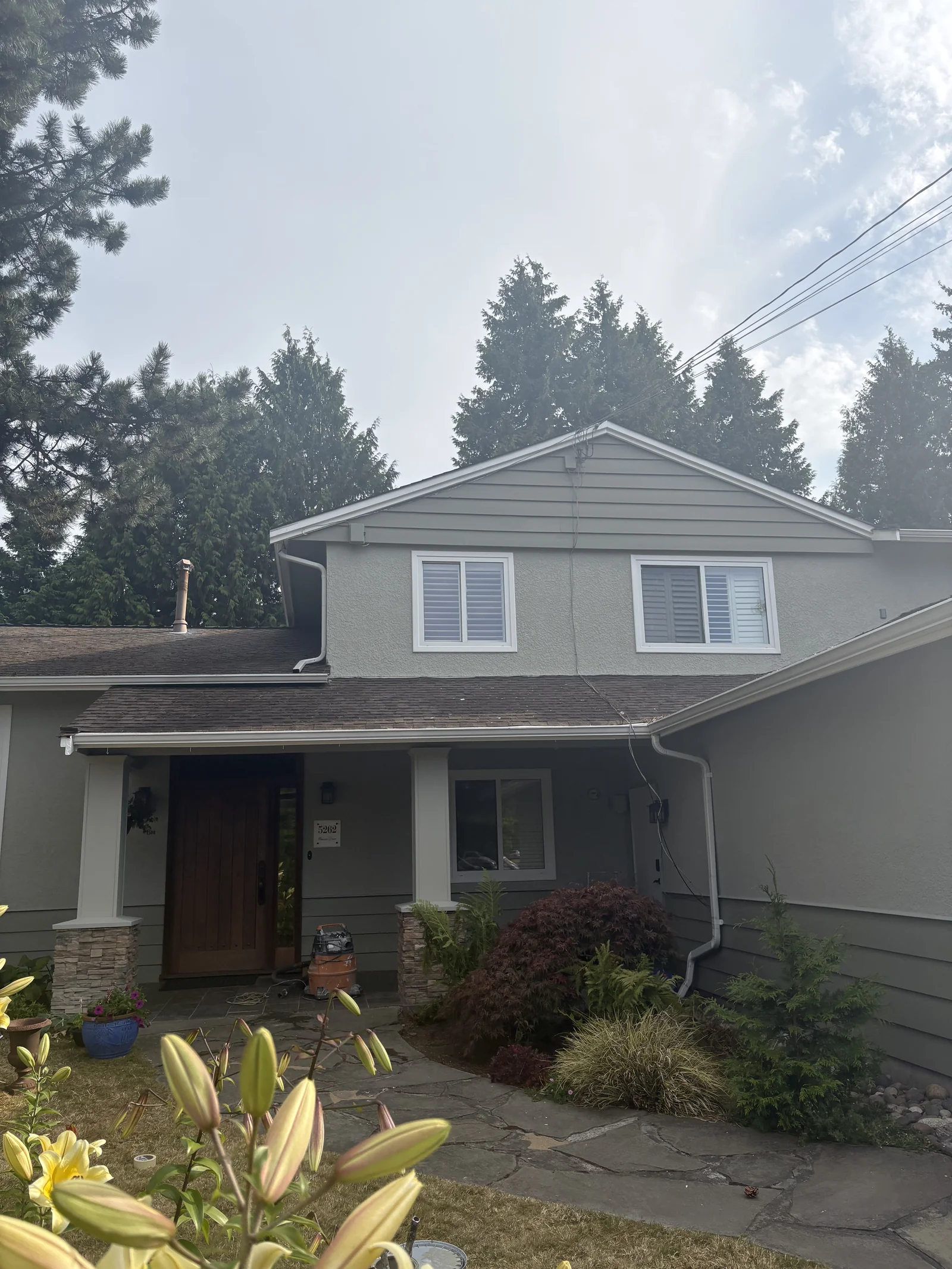 After — Sheila residence front view, Tsawwassen Delta BC — Honed Soapstone wood siding
