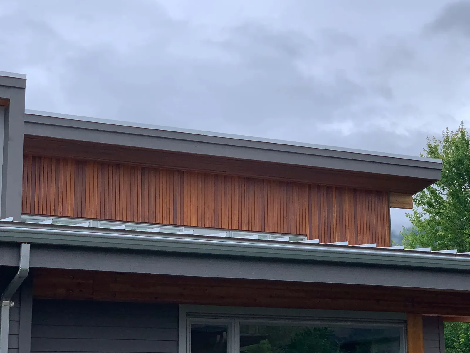 After — Cedar garage door with amber Sikkens stain, Squamish BC