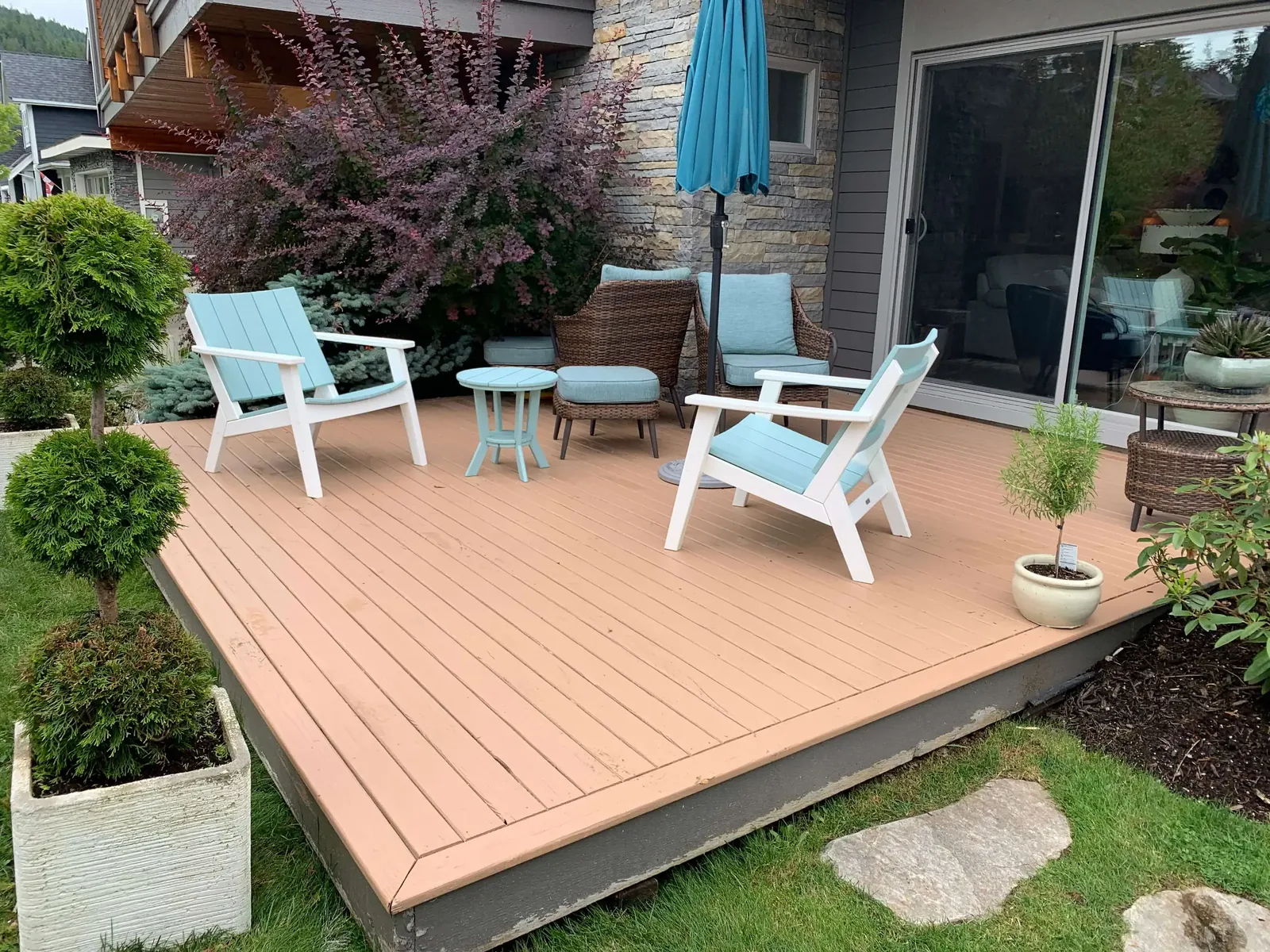 After — Cedar deck boards with amber Sikkens stain, Squamish BC