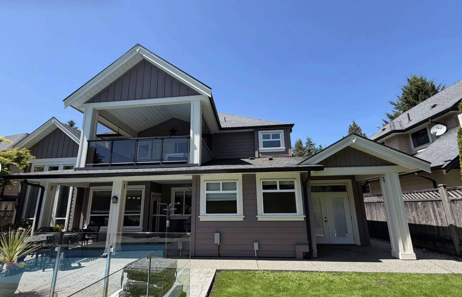 Tsawwassen BC exterior painting after — charcoal grey with white trim