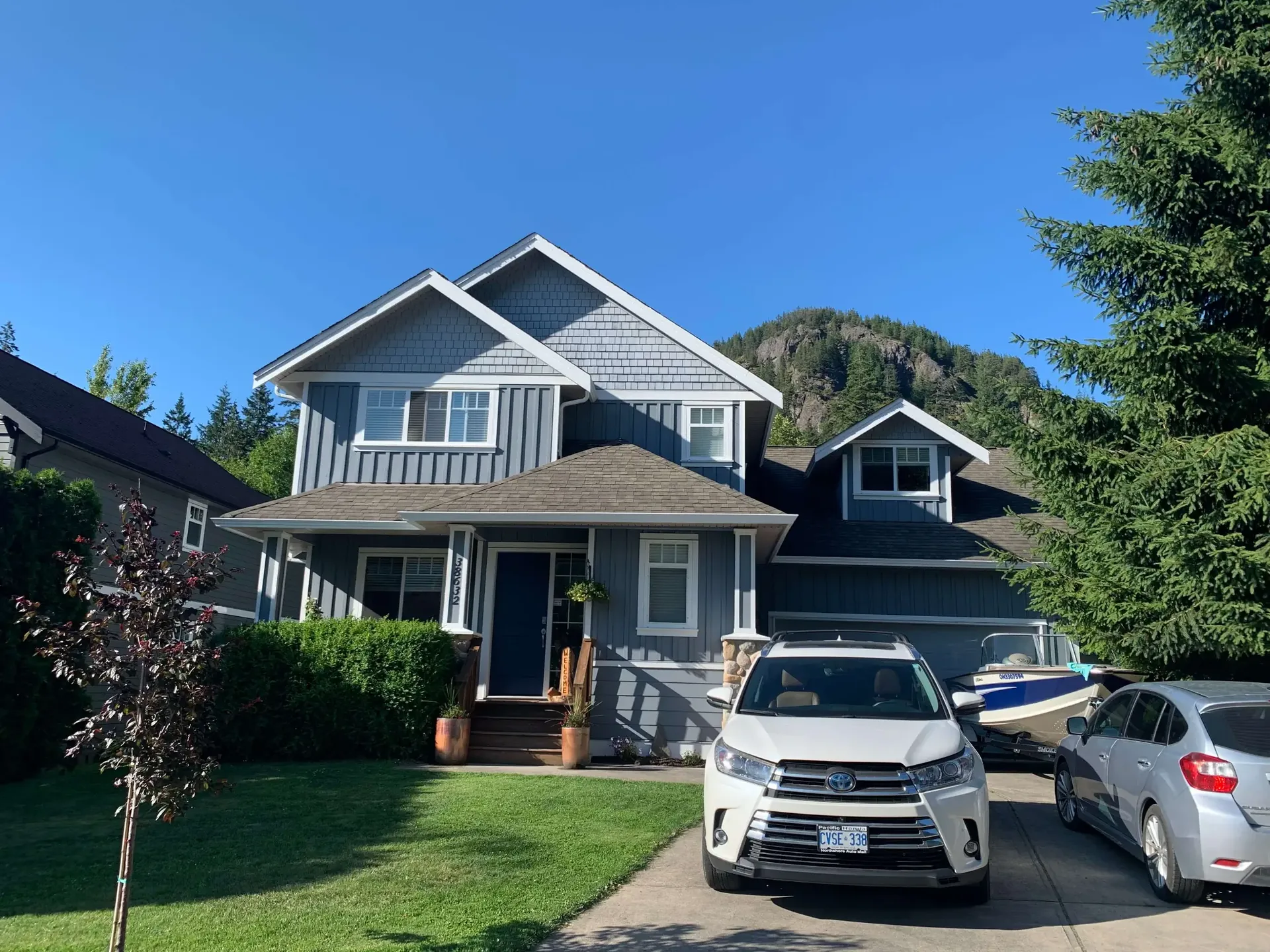 Completed exterior painting — Valley Cliff Squamish BC, blue-grey siding by Colour Craft Painting