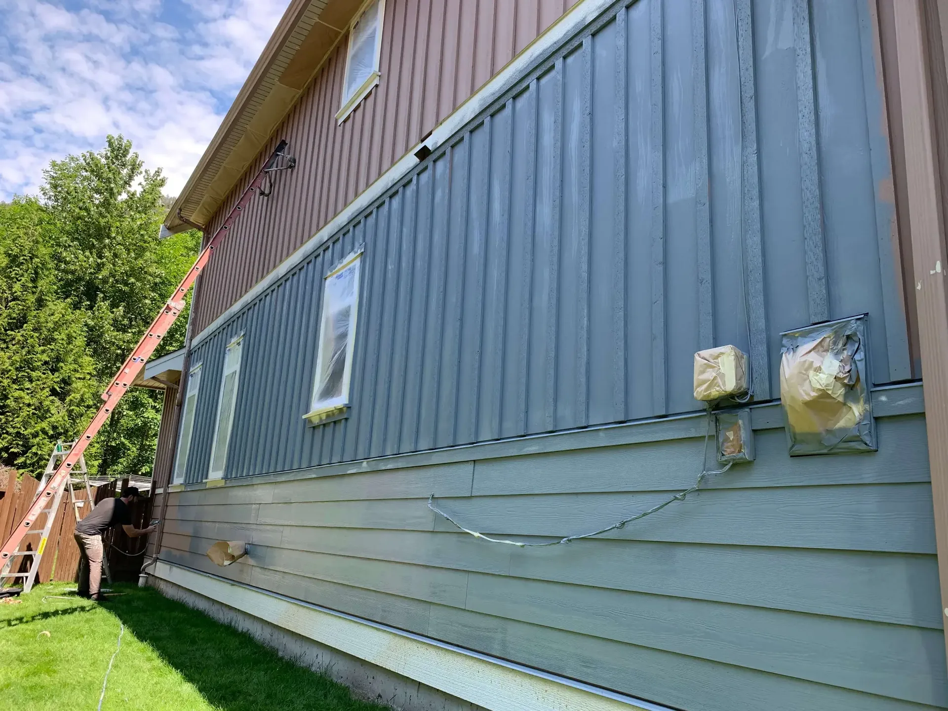 In progress — masking and prep, exterior painting Valley Cliff Squamish BC