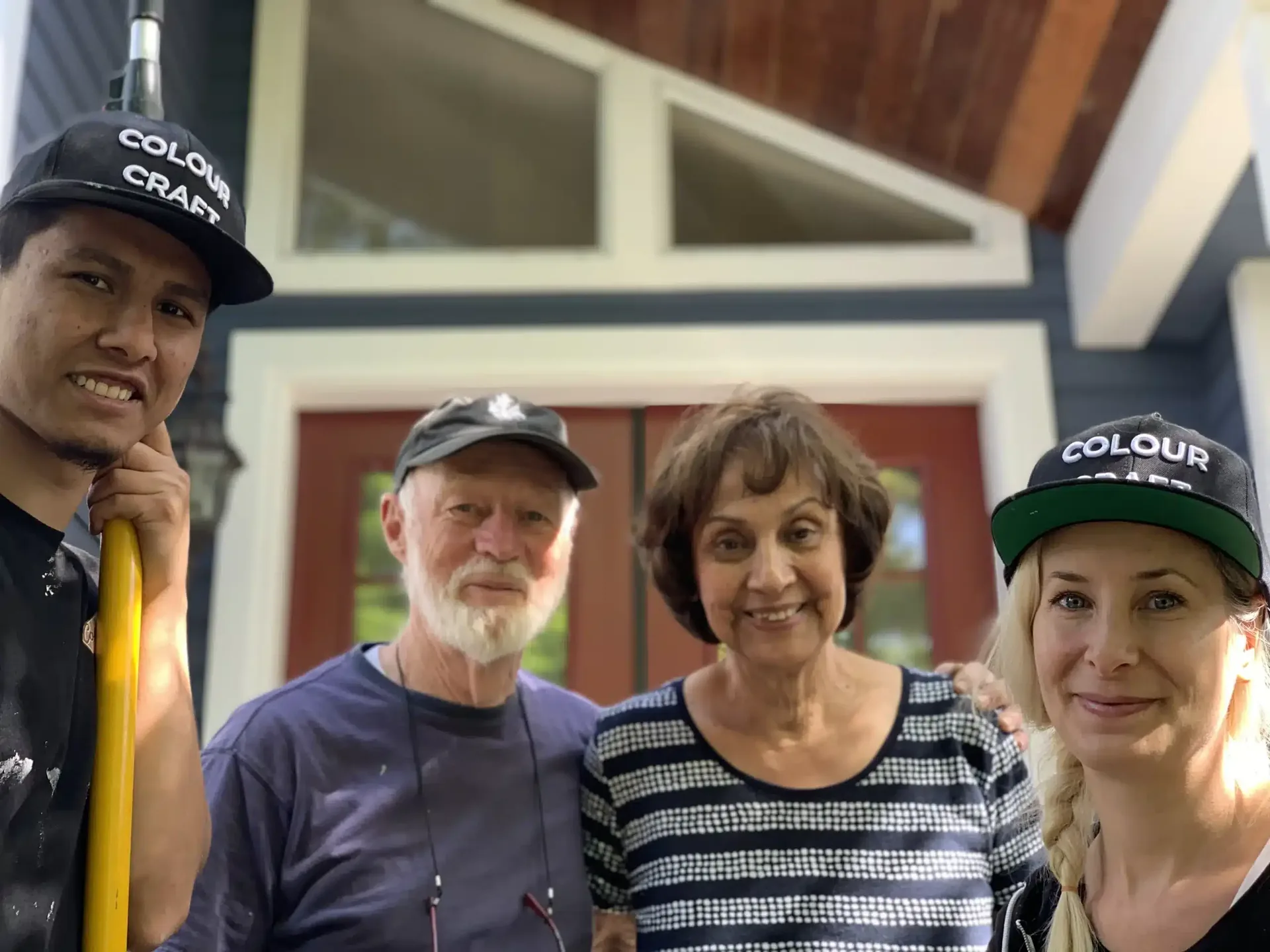Interior painting in Vancouver BC — homeowners with Colour Craft Painting crew at completed project