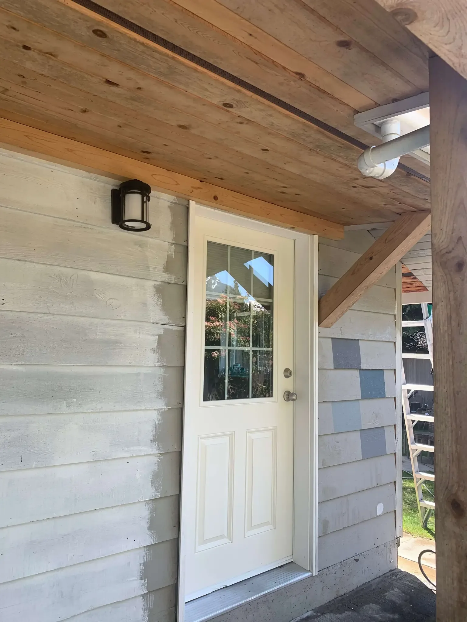 Before — Yves residence door detail, Garibaldi Highlands Squamish — colour samples on siding