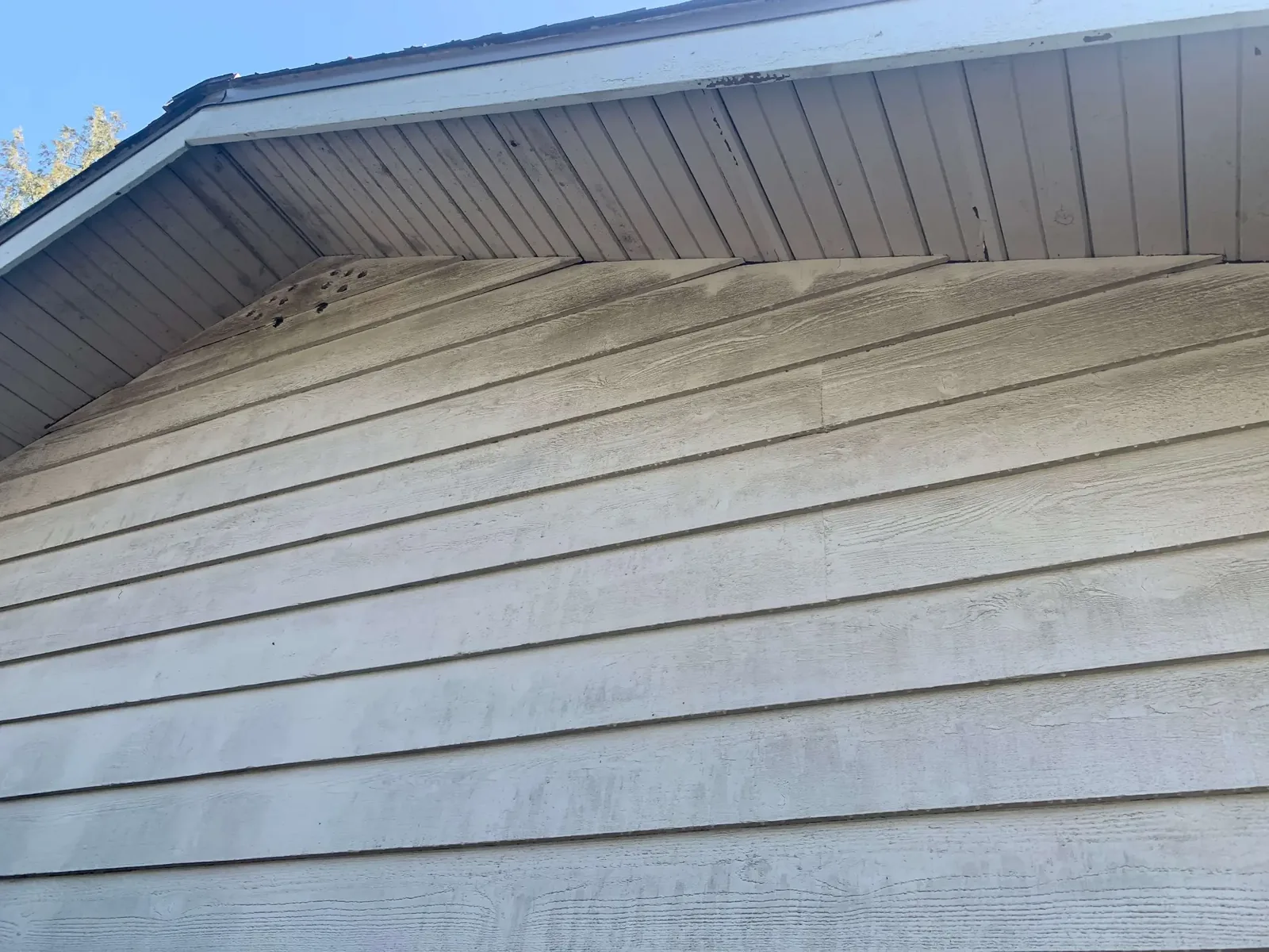 Before — Yves residence siding closeup, Garibaldi Highlands Squamish — weathered condition