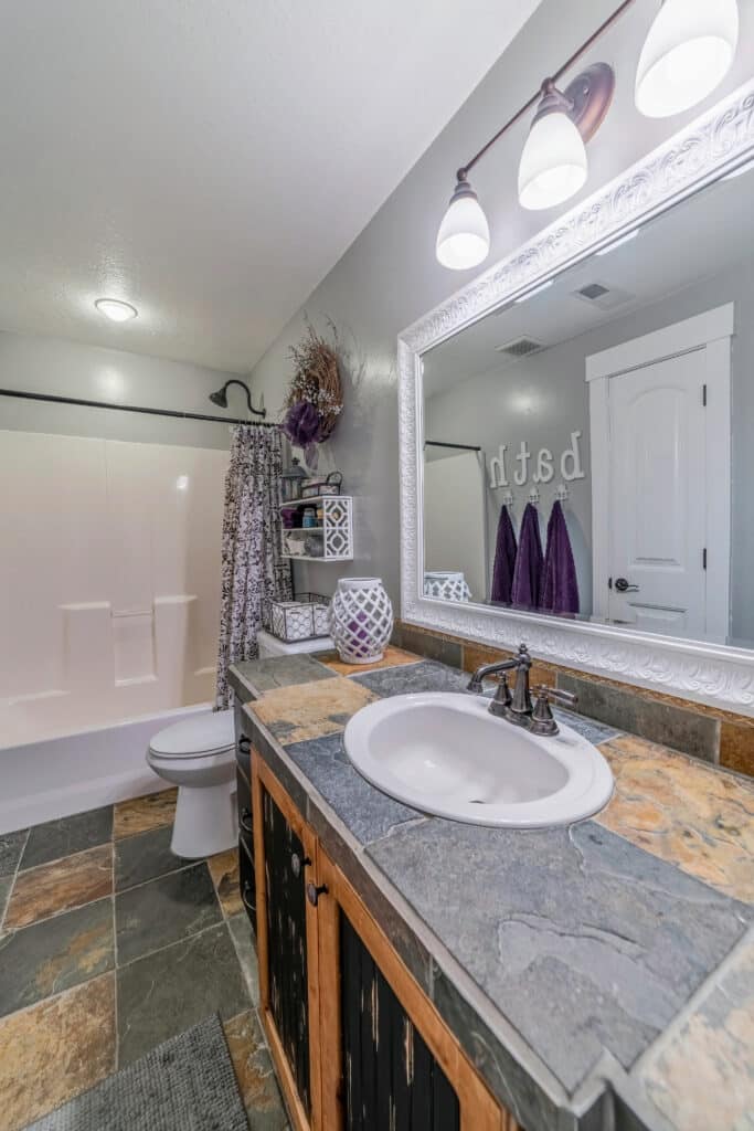 Modern bathroom interior of a house with clean built in bathtub and tiled floor